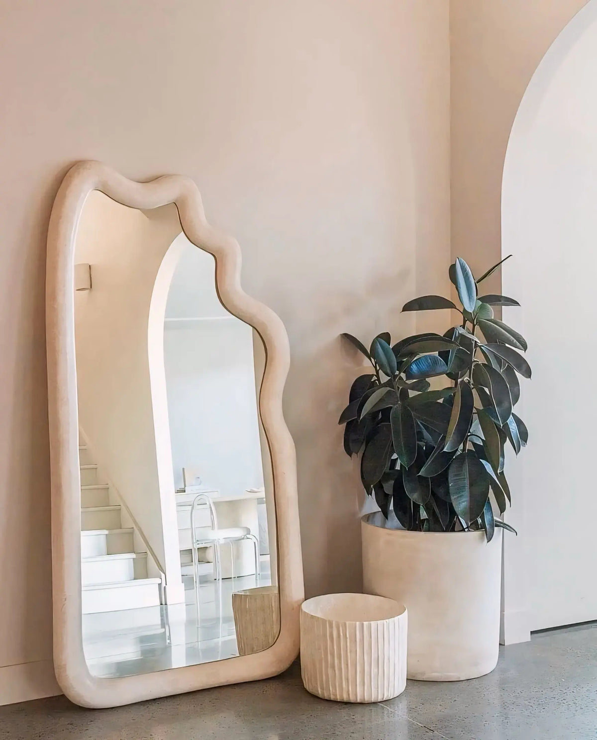 Tochio Wave-Shaped Wall Mirror in a hallway
