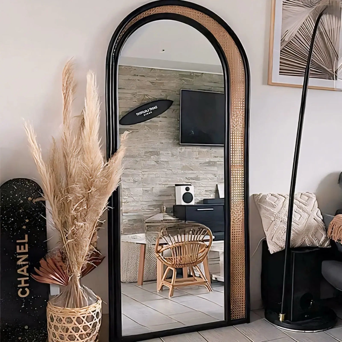 Nordan Arched Rattan Mirror in a living room