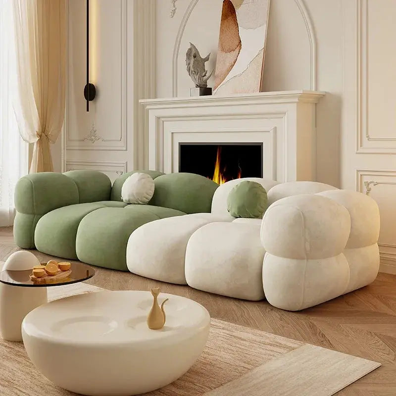 Paten Sofa in green and cream, styled in a living room