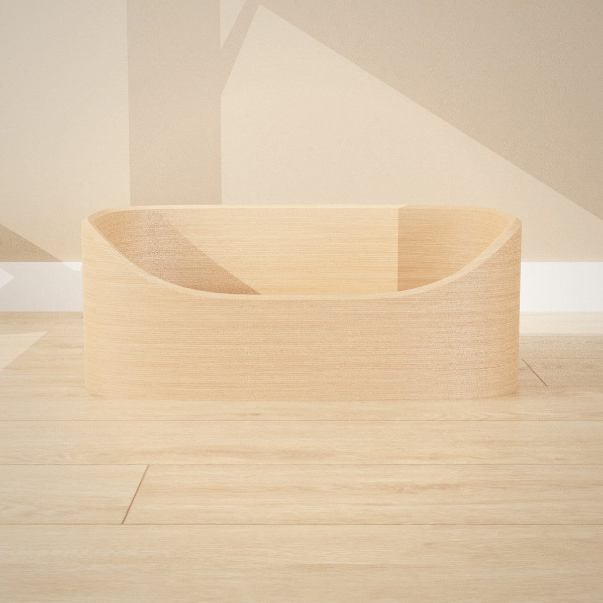 Maru Pet Bed: curved bentwood pet bed with a soft grey cushion, seen from the front
