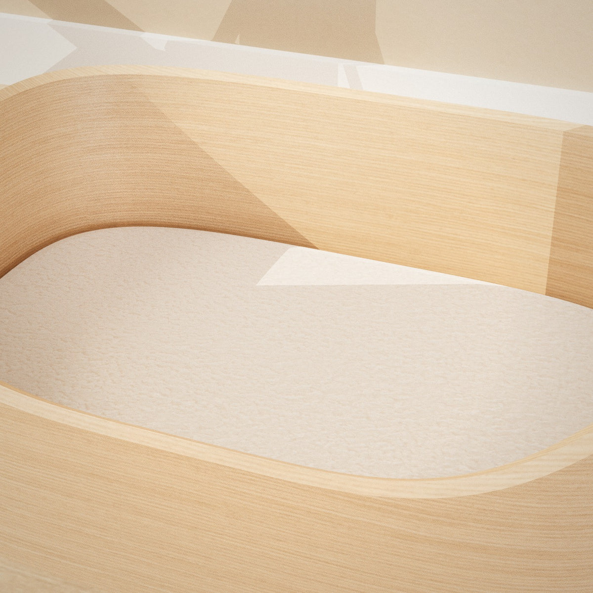 Maru Pet Bed: curved bentwood pet bed with a soft grey cushion, close-up of the cushion and wood finish