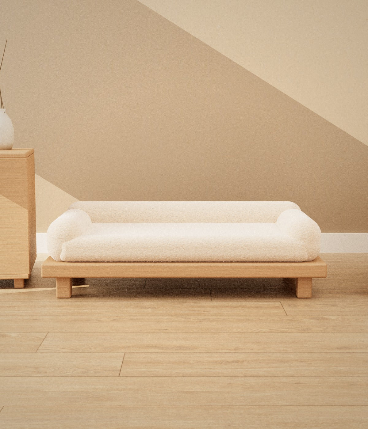 Shiro pet sofa in cream bouclé on an oak base in a sunlit Japandi room