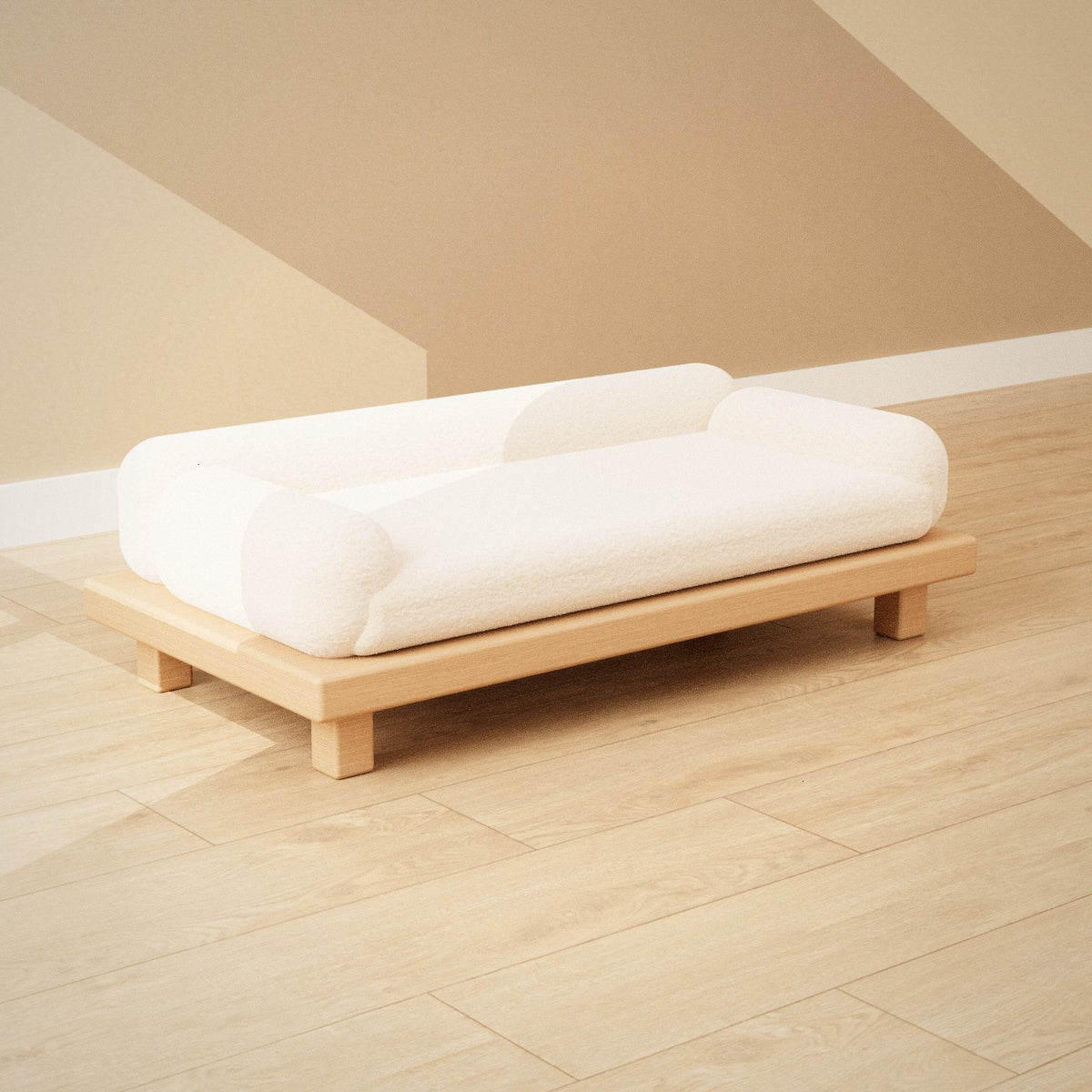 Shiro Pet Sofa: low oak pet sofa with a cream bouclé cushion and bolster sides, seen from the left